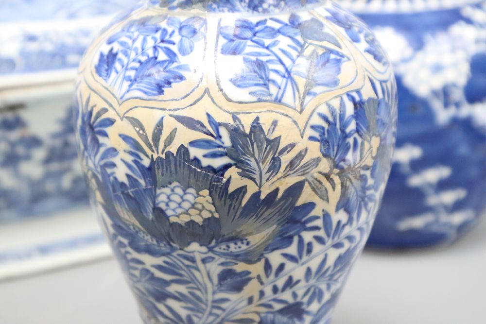 An 18th century Chinese blue and white tureen and cover, height 25cm, a Kangxi blue and white vase and three jars